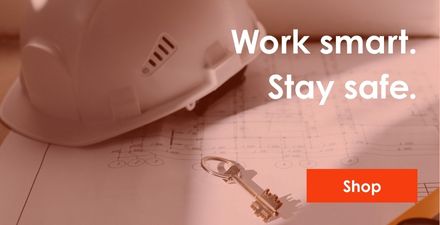 White construction helmet resting on a blueprint with a wrench placed nearby. At the top right, the text reads 'Work on Your Safety' and at the bottom right, there's a 'Shop Now' button.